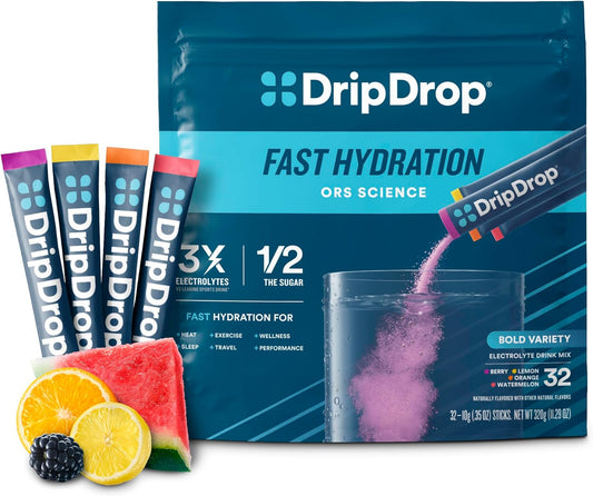 DripDrop ORS packaging with sticks and a container, surrounded by fruits on a white background.
